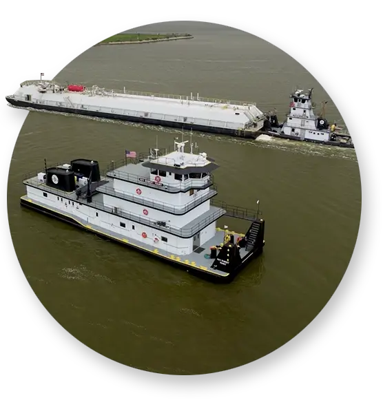 Two Southern Devall towboats in the gulf; one with a barge and one without