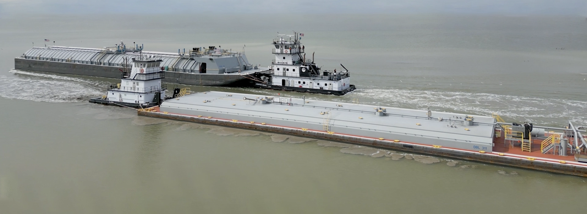 Two Southern Devall barge vessels passing by one another