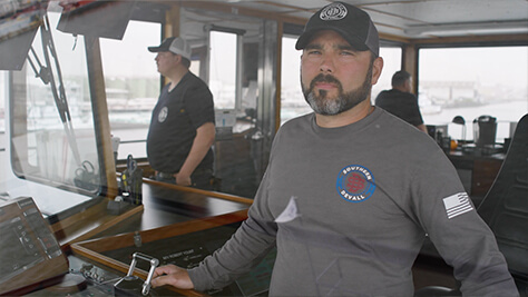 Southern Devall captain looking out of the window on a towboat