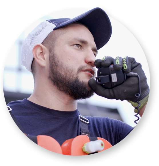 A Southern Devall employee speaking into a walkie talkie