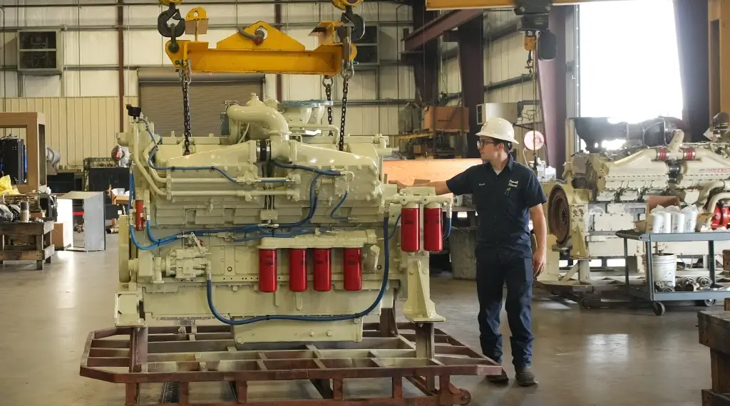 Southern Devall technicians preparing to lift a diesel engine up to work on it