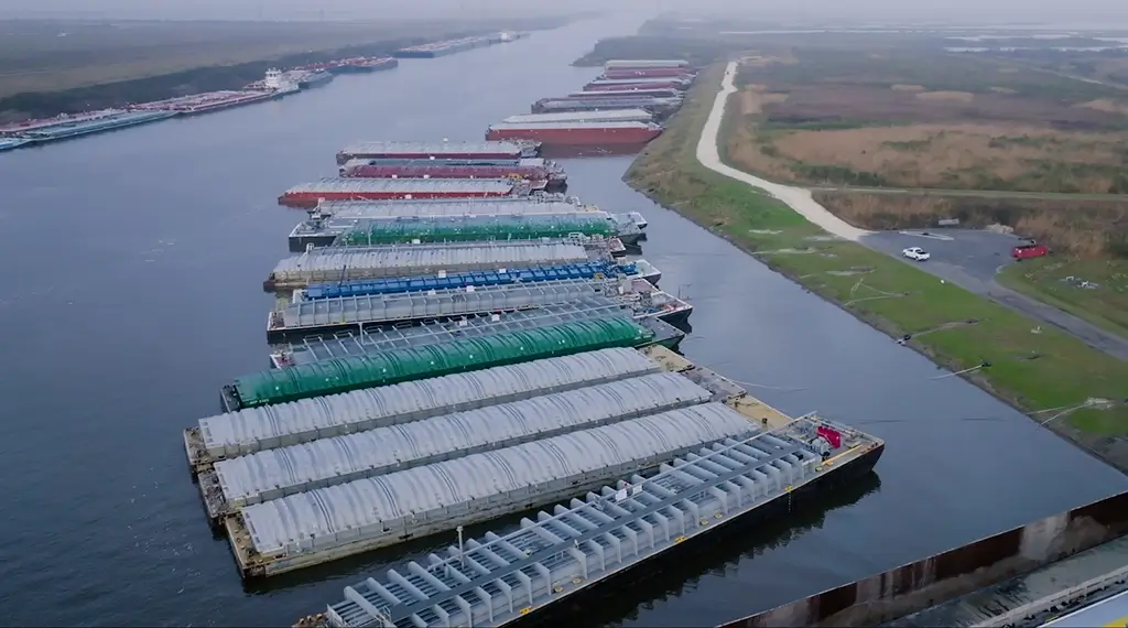 A series of barges lined up for fleeting