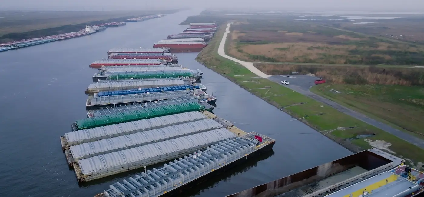 A series of barges lined up for fleeting