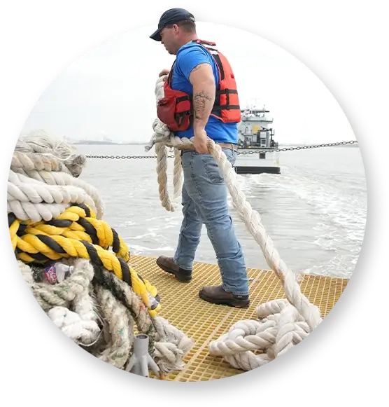 A Southern Devall crewman pulling a dope on a pier