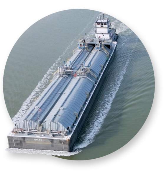 A Southern Devall towboat hauling chemical cargo down a waterway