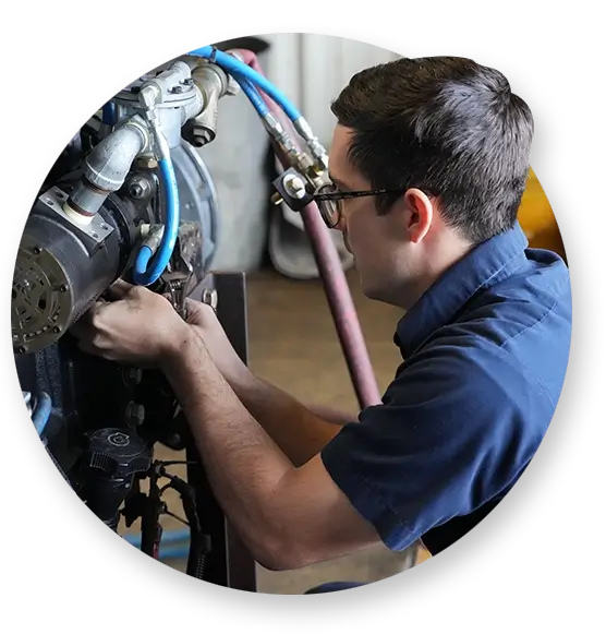 A Southern Devall technician tightening screws on a diesel engine