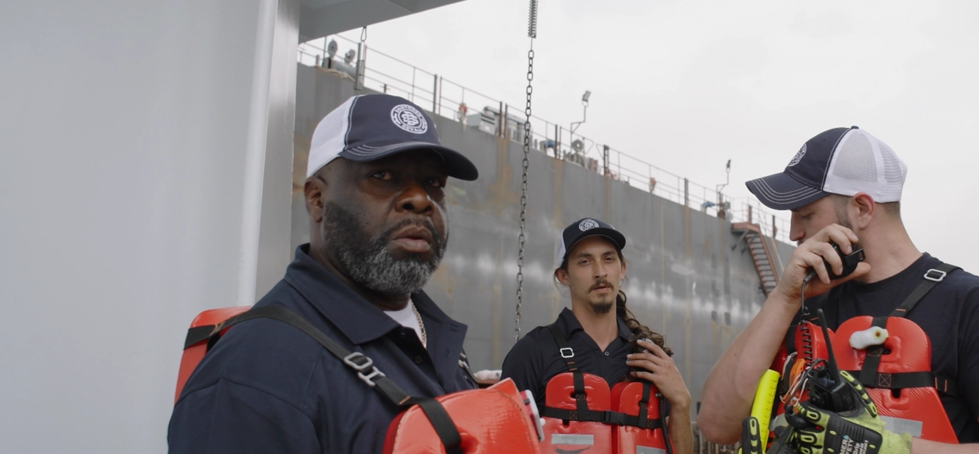 Three Southern Devall deckhands getting on their walkie talkies